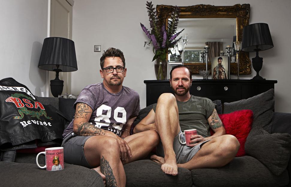 Stephen Webb (left) and Chris Steed sit on a couch.
