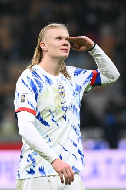Erling Haaland saluting in his Norway national football team jersey.