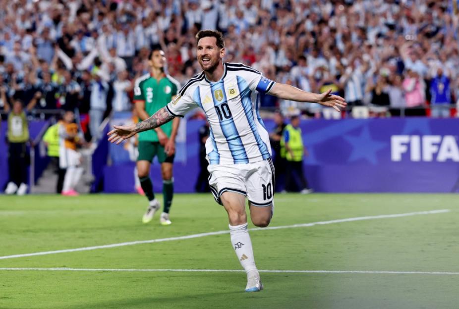 Lionel Messi in an Argentina jersey celebrating during a FIFA World Cup 2026 Group J match against Algeria.