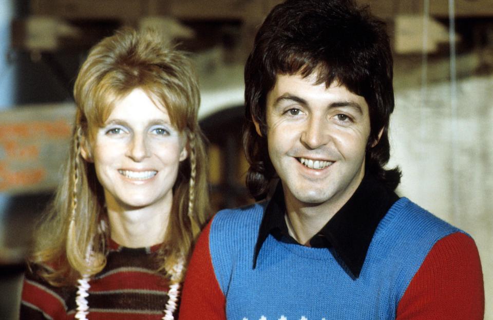 Linda and Paul McCartney smiling at the camera.