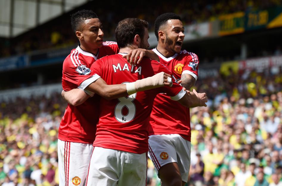 Juan Mata, Jesse Lingard, and Memphis Depay celebrate a goal for Manchester United.