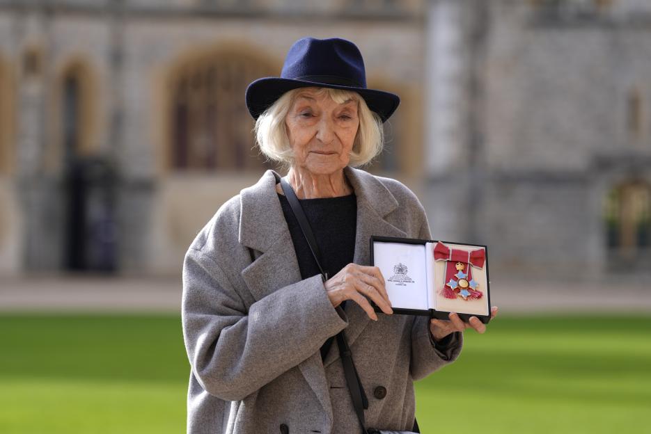 Actress Jane Lapotaire holds her CBE medal at an investiture ceremony at Windsor Castle.
