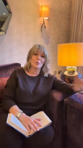 Ruth Langsford teasing a tell-all book while sitting in a chair.