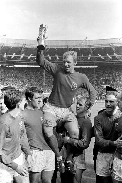 Jul. 07, 1966 - Football the 1966 World Cup. The Final England V. West Germany at Wembley Stadium. England won 4-2 after extra time.: Bobby Moore (England's Captain) leads his team around the Wembley Pitch after England's World Cup Final victory agai