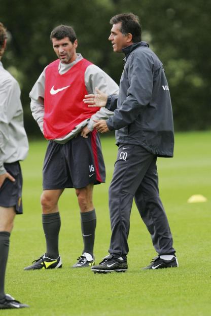 Manchester United first team training with players and coaches on the field.