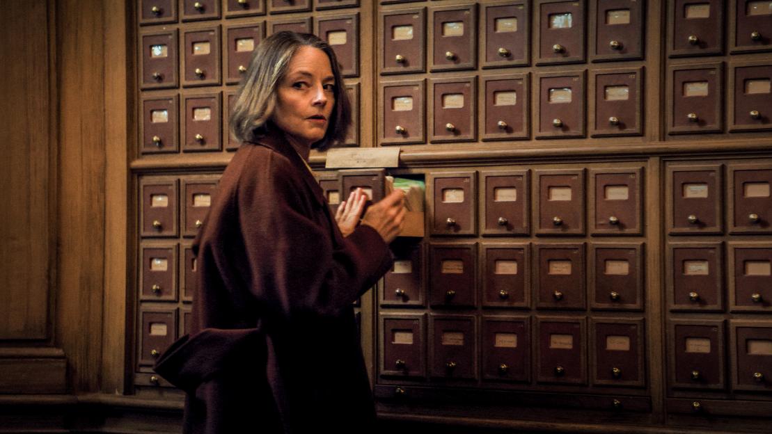 Jodie Foster as Lilian Steiner pulling a drawer from a wall of filing cabinets.