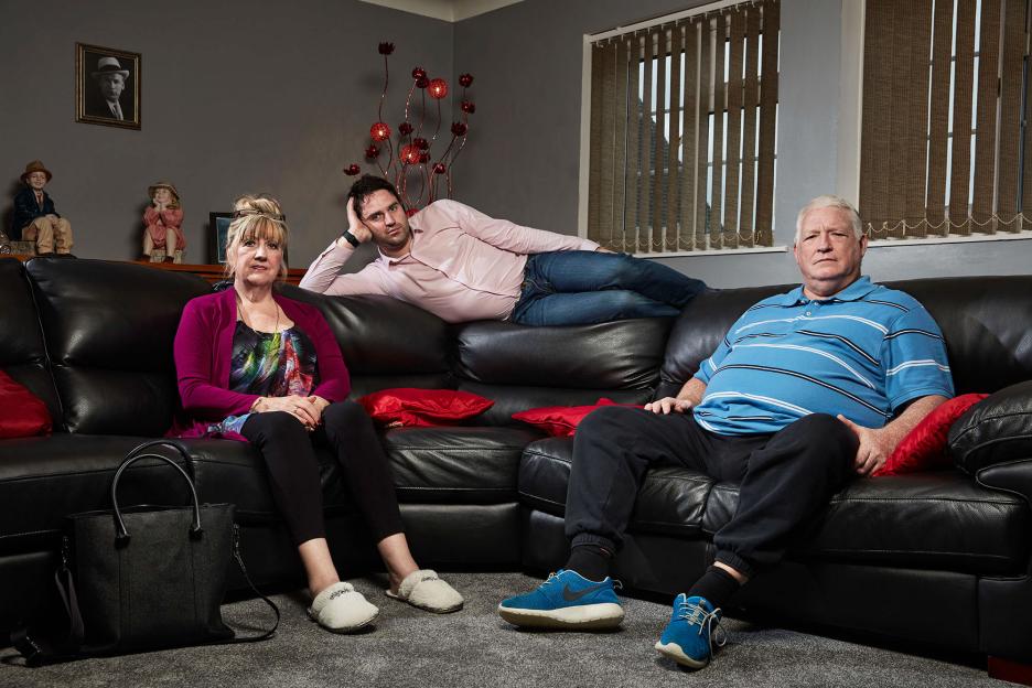 George Gilbey and his parents on a couch from the show Gogglebox.