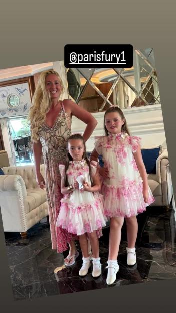 Paris Fury poses with her two young daughters.