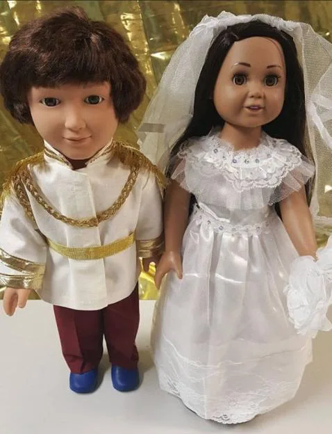 Two dolls dressed as Prince Harry and Meghan Markle on their wedding day.
