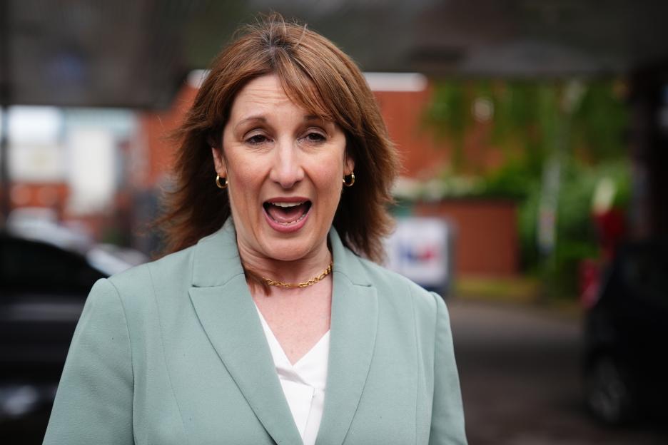 Rachel Reeves, Chancellor of the Exchequer, speaking to the media at a petrol station.