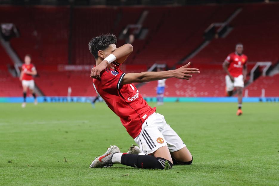 JJ Gabriel celebrates scoring a goal for Manchester United.