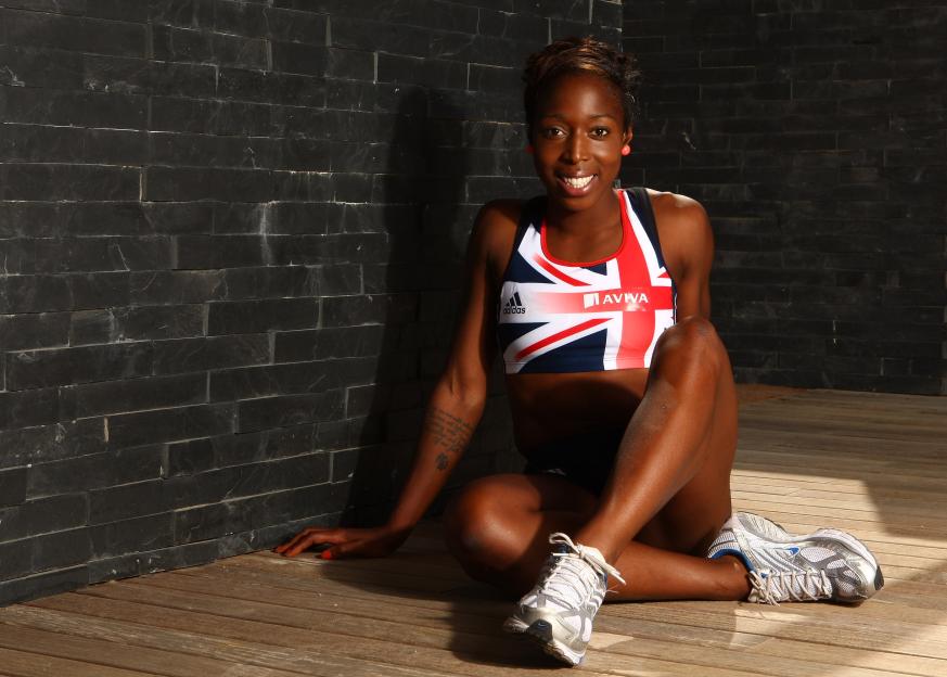 Jeanette Kwakye of Great Britain in athletic wear, smiling at the camera.