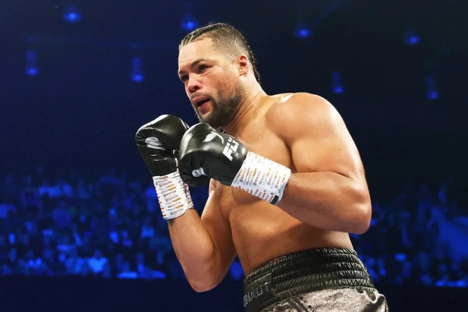 Joe Joyce in the ring with his hands up in a fighting stance.