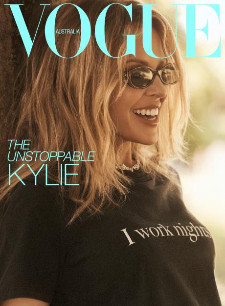 Kylie Minogue smiling and wearing sunglasses on the cover of Vogue Australia.