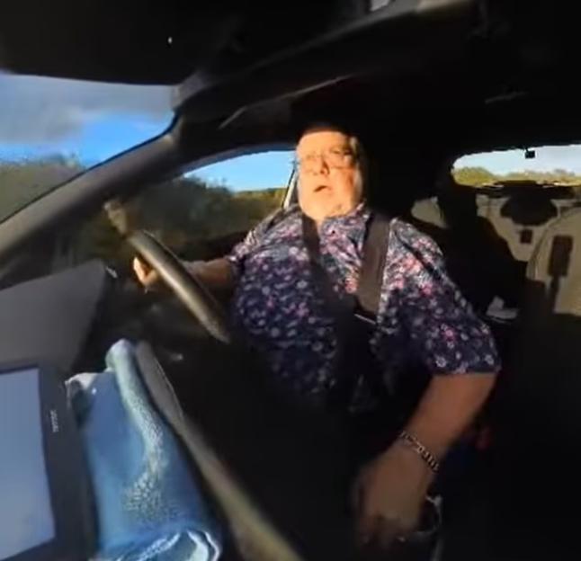 Driving instructor Jon Dick seen from inside his car.