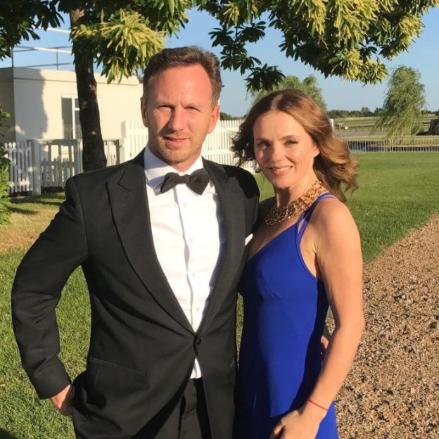 Christian Horner and Geri Halliwell posing together outdoors.