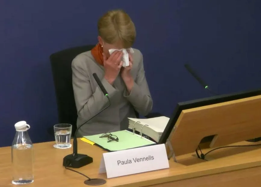 Paula Vennells wiping her eyes with a tissue while giving evidence at the Post Office Horizon IT Inquiry.