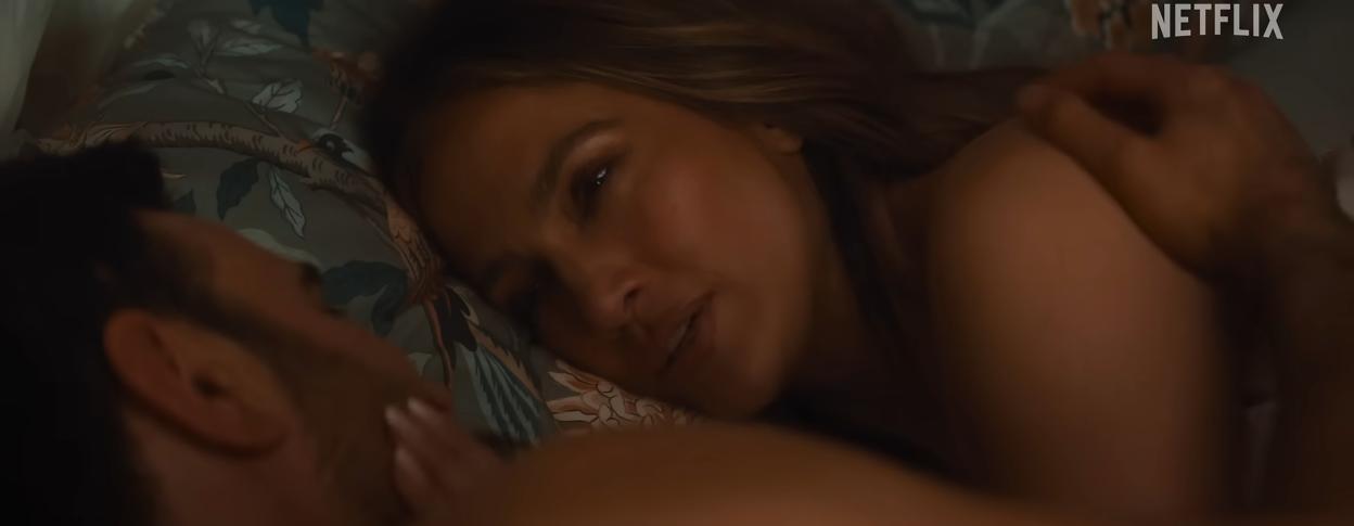 Jennifer Lopez and Brett Goldstein in a romantic moment in bed.