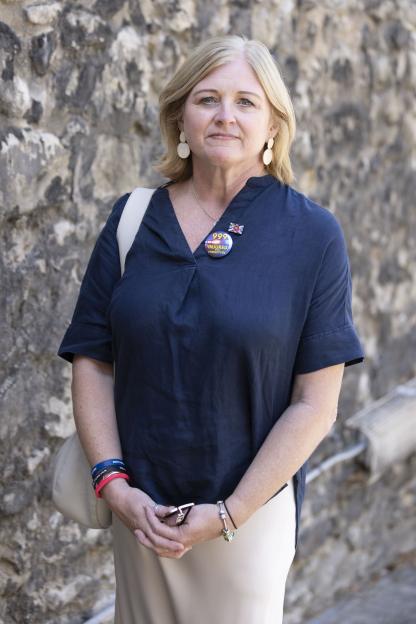 Debbie Adlun, mother of PC Andrew Harper, wearing a "999 Injured and Forgotten" button.
