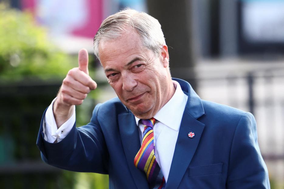 Nigel Farage giving a thumbs up after local election results.