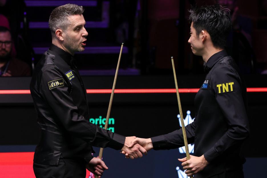Wu Yize (China) shakes hands with Mark Selby after defeating him 13-11 during Round 2 of the Halo World Snooker Championship 2026 at The Crucible Theatre, Sheffield, England on 27 April 2026 Credit: Ryan Crockett/Every Second Media