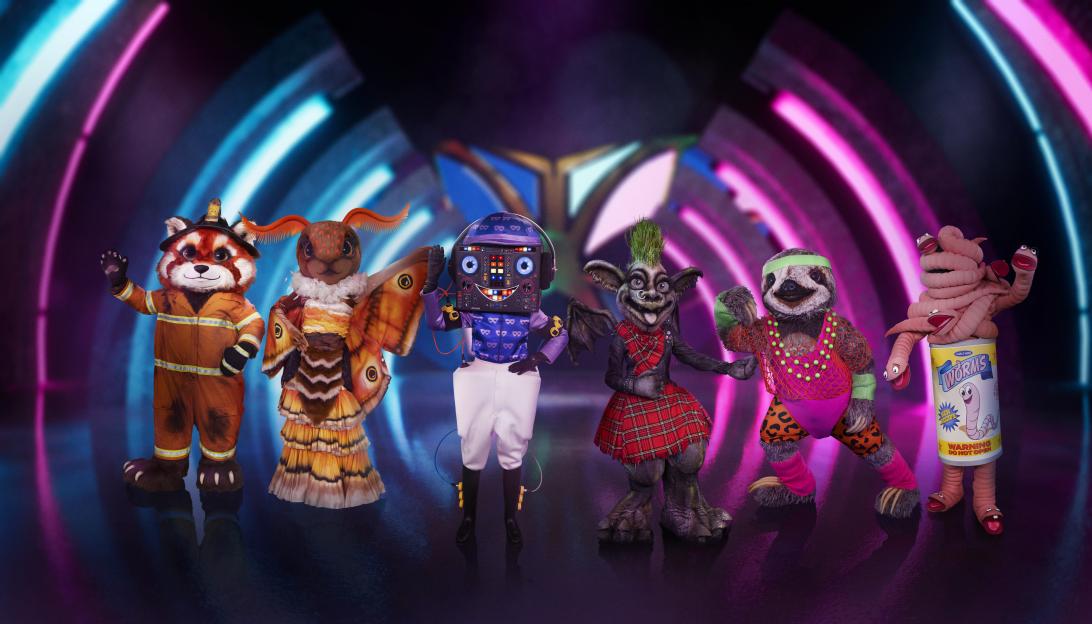 Six costumed characters from "The Masked Singer": Red Panda, Moth, Disc Jockey, Gargoyle, Sloth, and Can of Worms.