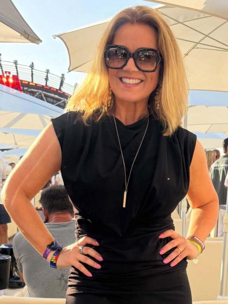 Susanna Reid smiling and posing in sunglasses at a party in Ibiza.