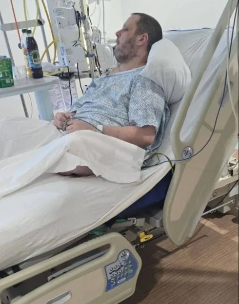 James recovering in a hospital bed.