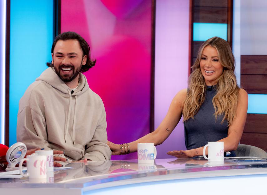 Bradley Dack and Olivia Attwood smiling during an ITV daytime television program.