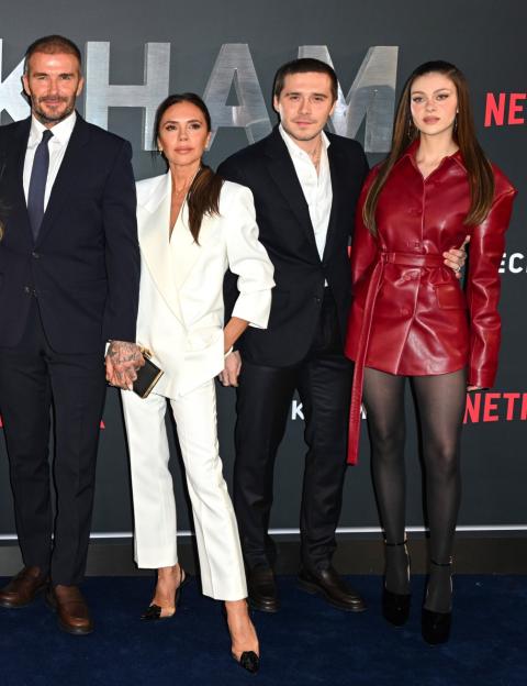 David Beckham, Victoria Beckham, Brooklyn Beckham, and Nicola Peltz Beckham on the red carpet.