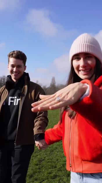 Zara Zoffany showing off her engagement ring while holding hands with AJ Pritchard.