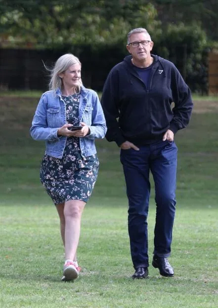 Graeme Hall and Nicola Worth walking together outdoors.