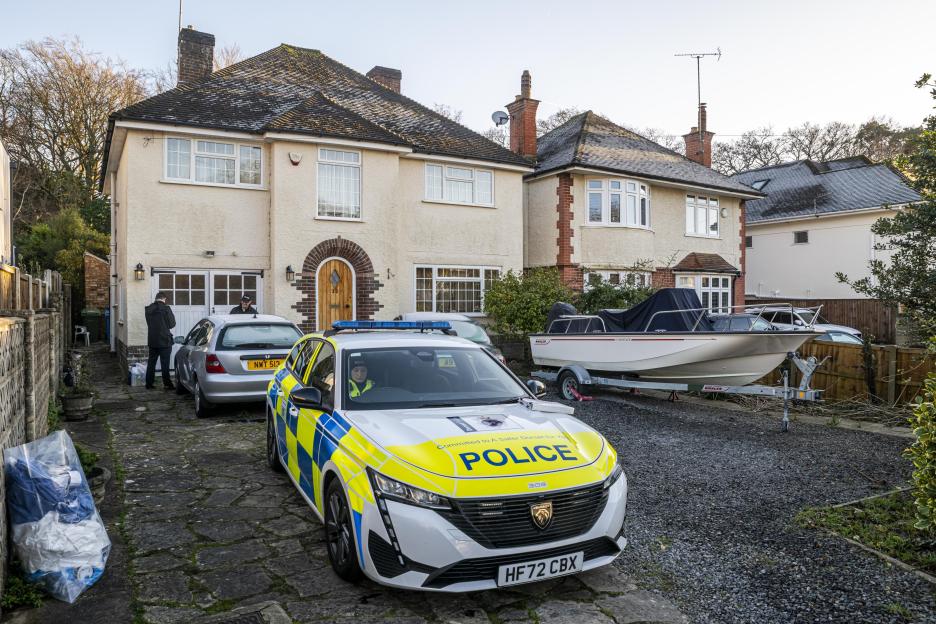 Police at the scene of an incident at a house.