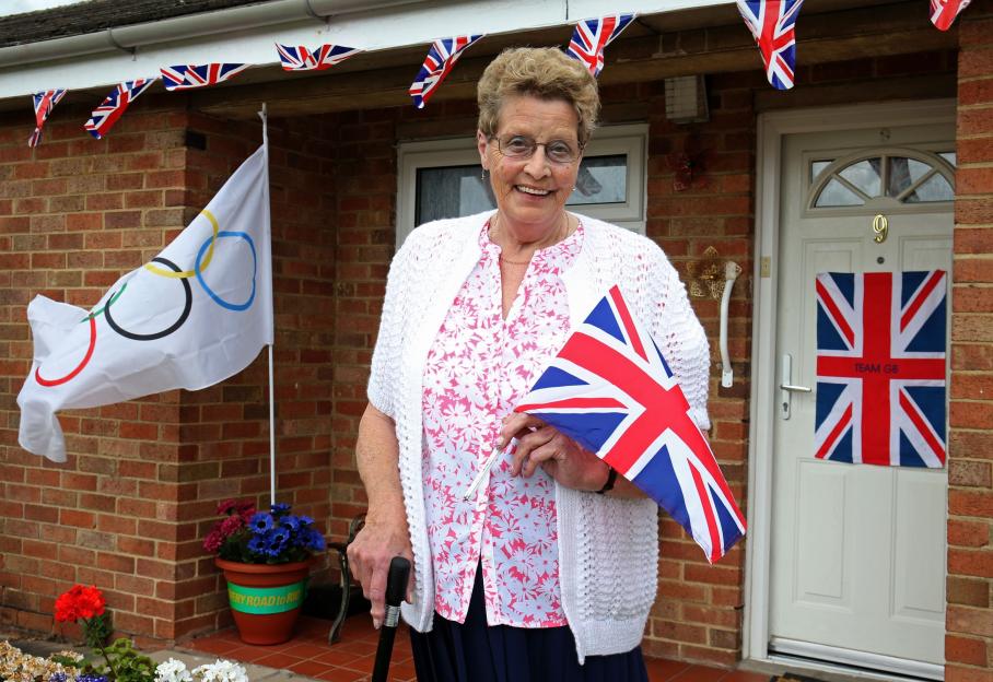 Mavis Williams, Adam Peaty's grandmother, outside her home decorated with British and Olympic flags.