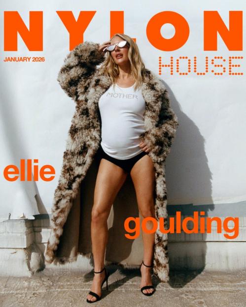 Ellie Goulding in Nylon magazine wearing a fur coat over a white top with "MOTHER" written on it, black underwear, and high heels.