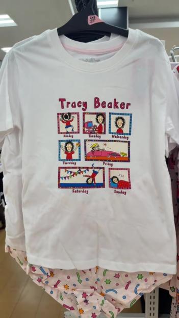 White Tracy Beaker pyjamas featuring illustrations of the character showing daily activities from Monday to Sunday.