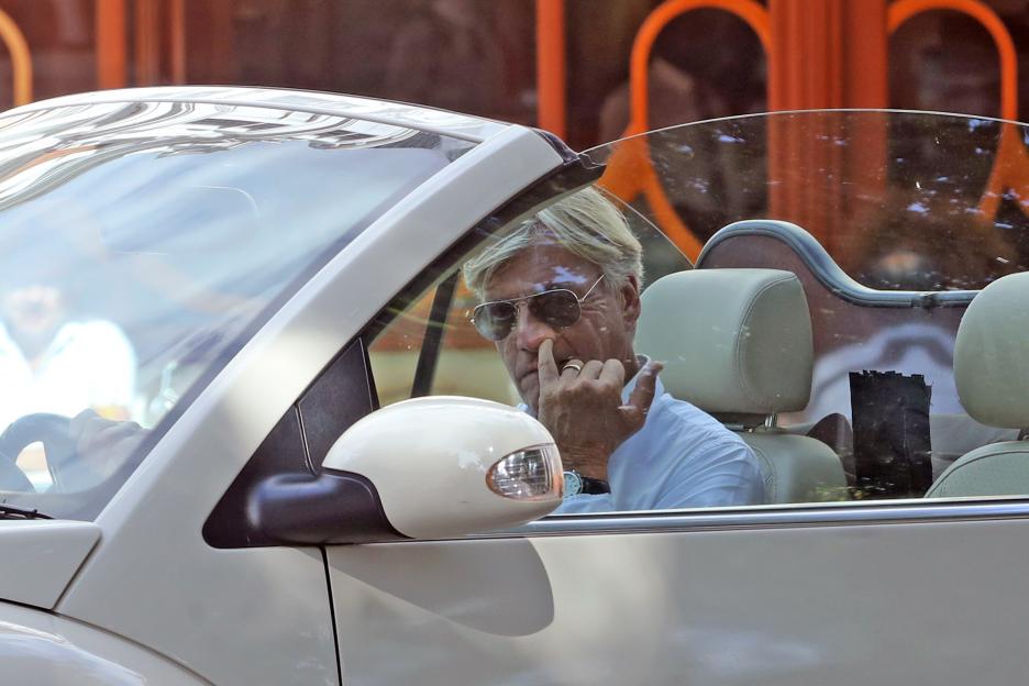 Richard Madeley picking his nose while driving.