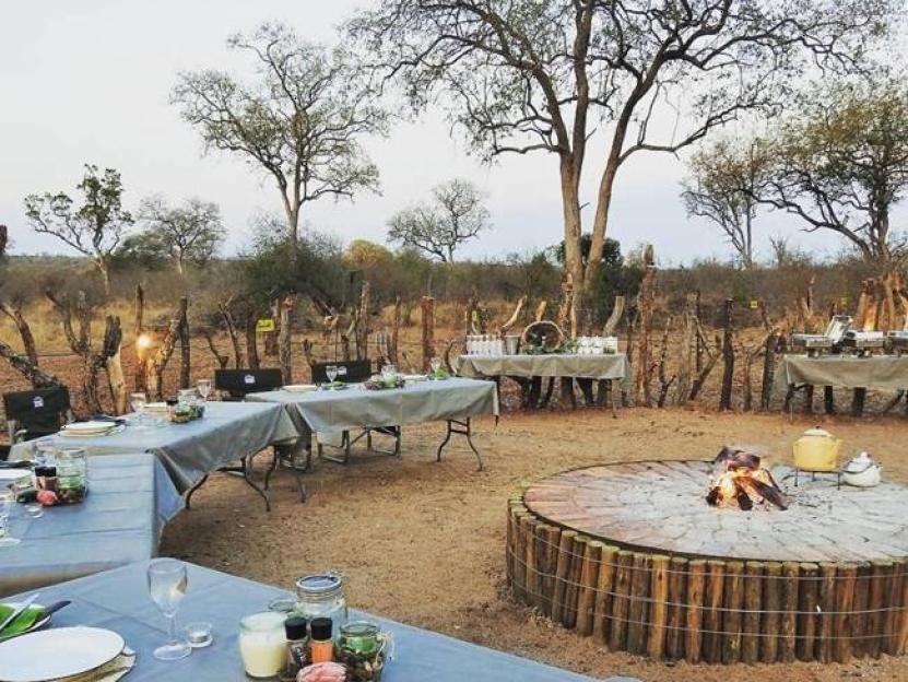 One of the many "bush and braai" (braai is Afrikaans for bbq) spots in the Kruger National Park where tourists can pay to enjoy supper with beers after a game drive at the Kruger National Park