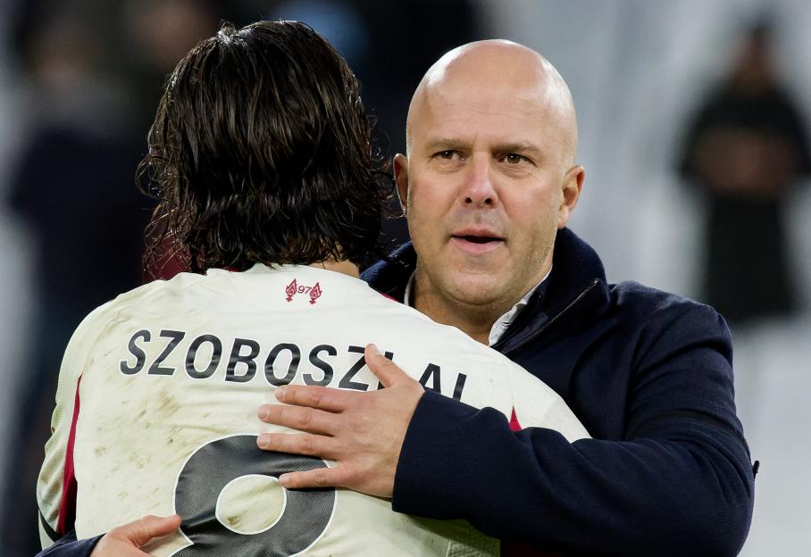 Liverpool manager Arne Slot embracing Dominik Szoboszlai after a match.