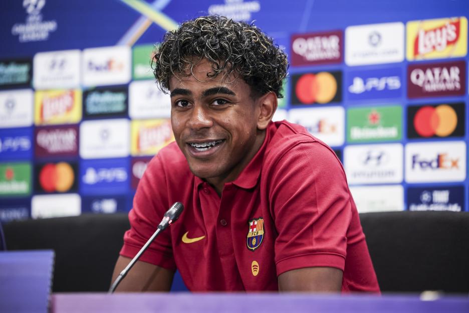 Lamine Yamal of FC Barcelona smiling during a press conference.