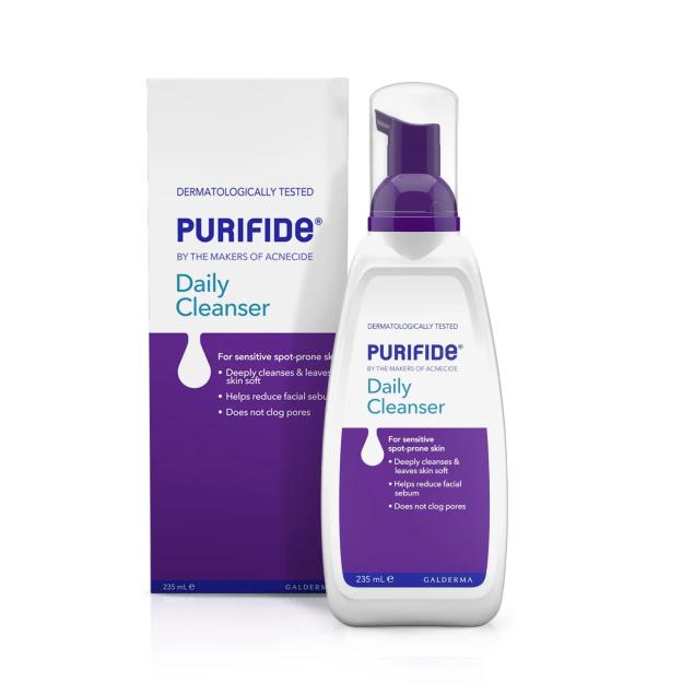 Purifide Daily Cleanser in a white pump bottle and its purple and white packaging.