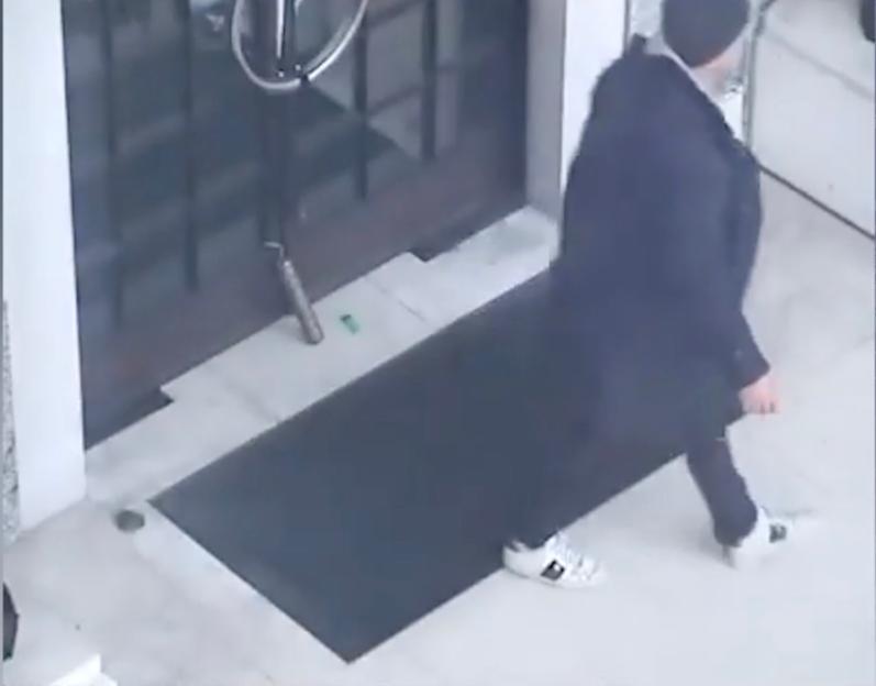 CCTV image of Julian Valente Pereira leaving a fake stick of dynamite.