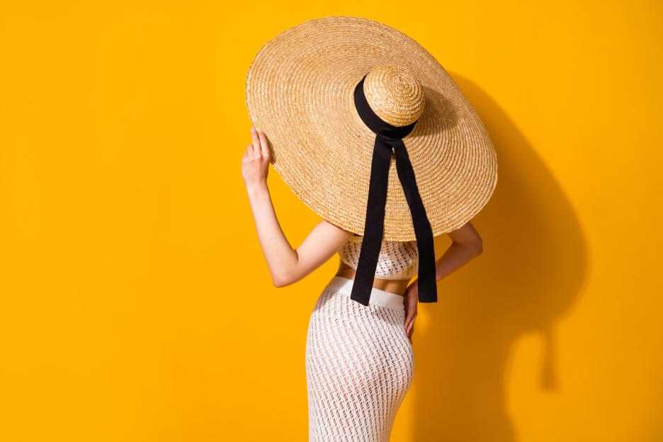 Photo of sexy adorable lady wear white outfit hand arm hat standing back empty space isolated yellow color background