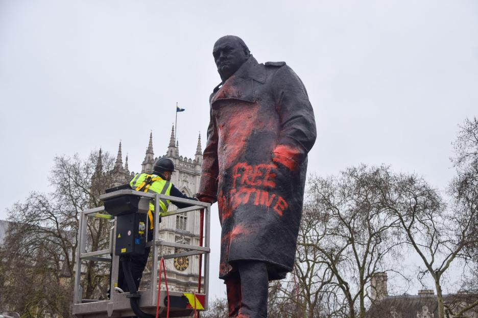 February 27, 2026, London, England, United Kingdom: A worker cleans the statue of Winston Churchill in Parliament Square in London after protesters sprayed red paint and wrote a??Free Palestinea?¿ and other graffiti on it. (Credit Image: ¿ Vuk Valcic