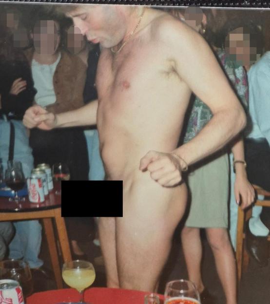 Jon Worboys partially nude with other people at a party.