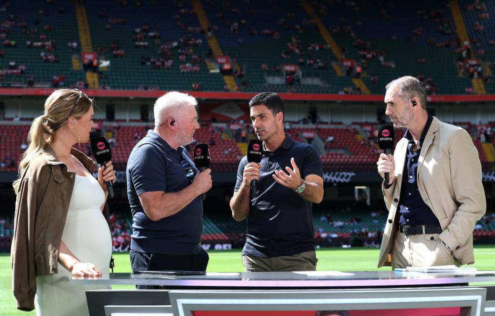 Arsenal manager Mikel Arteta speaks with TNT presenters Laura Woods, Ally McCoist, and Martin Keown at Principality Stadium.