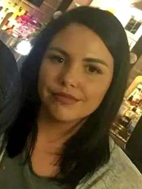 A photo of Alice Webb, a woman with dark hair and fair skin, looking towards the viewer.